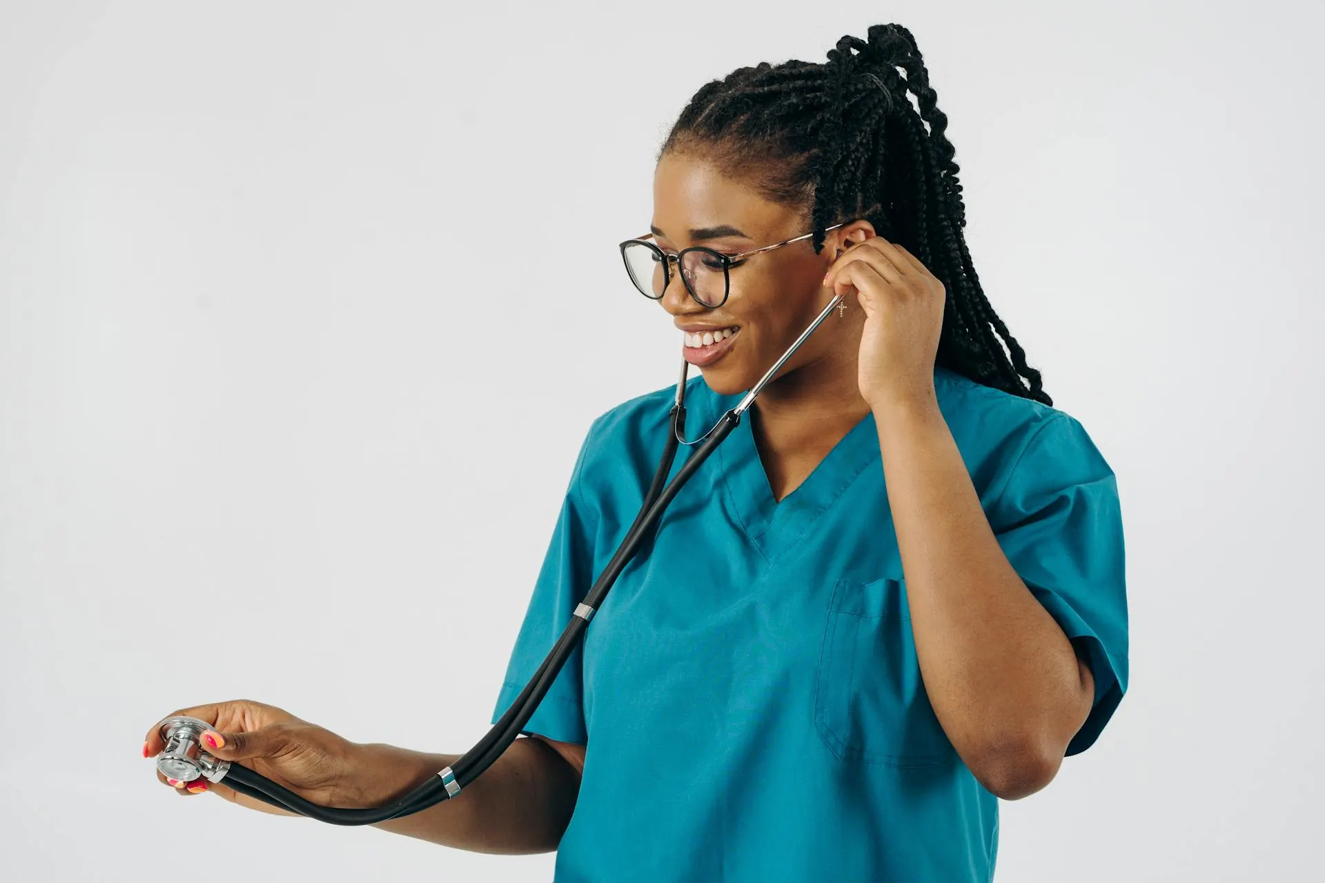 Smiling nurse in scrubs with a stethoscope — join the Pacific Homecare team